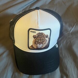 Black and White Trucker Hat with Lion Patch